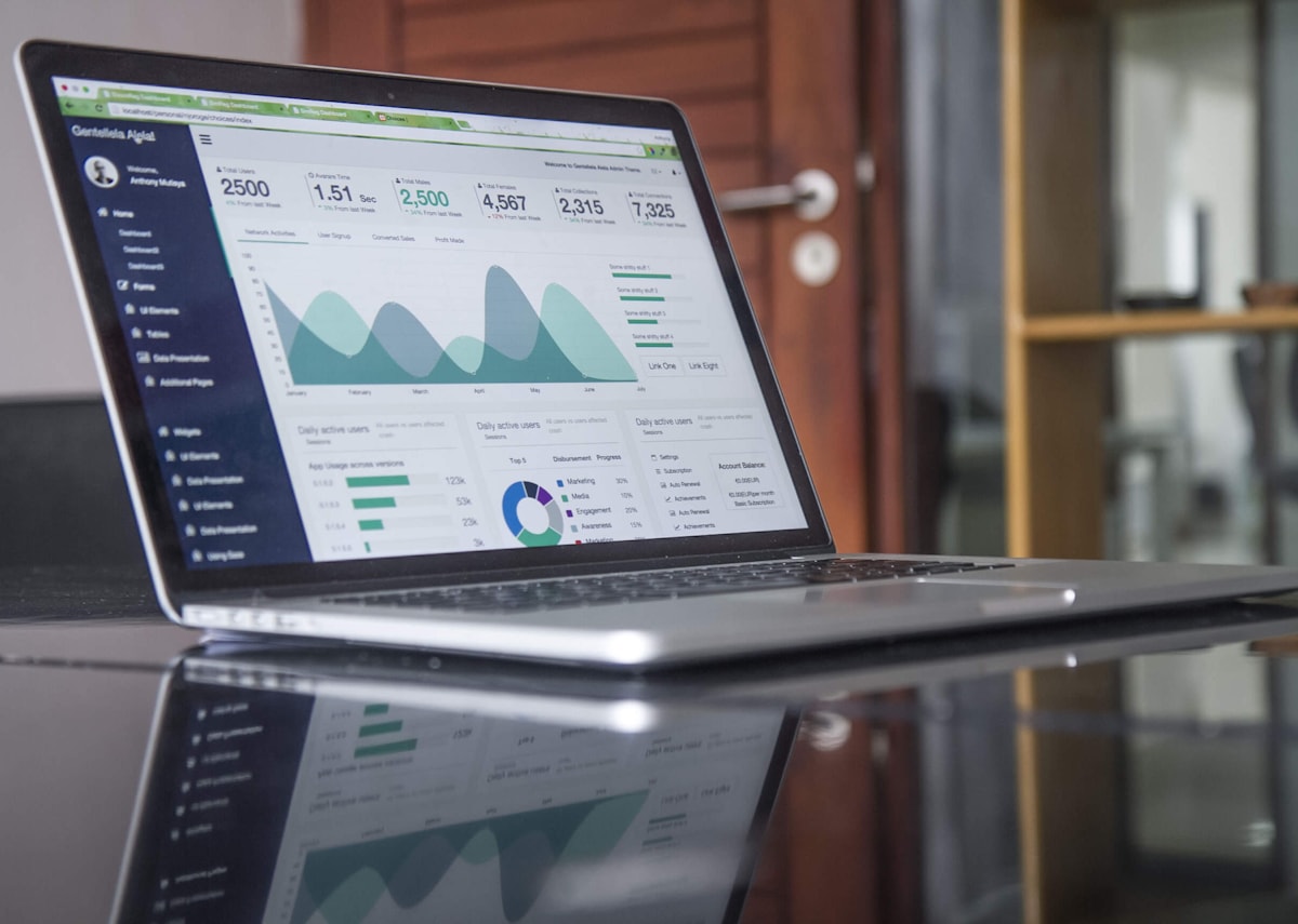 Laptop and charts representing tax planning and compliance work.